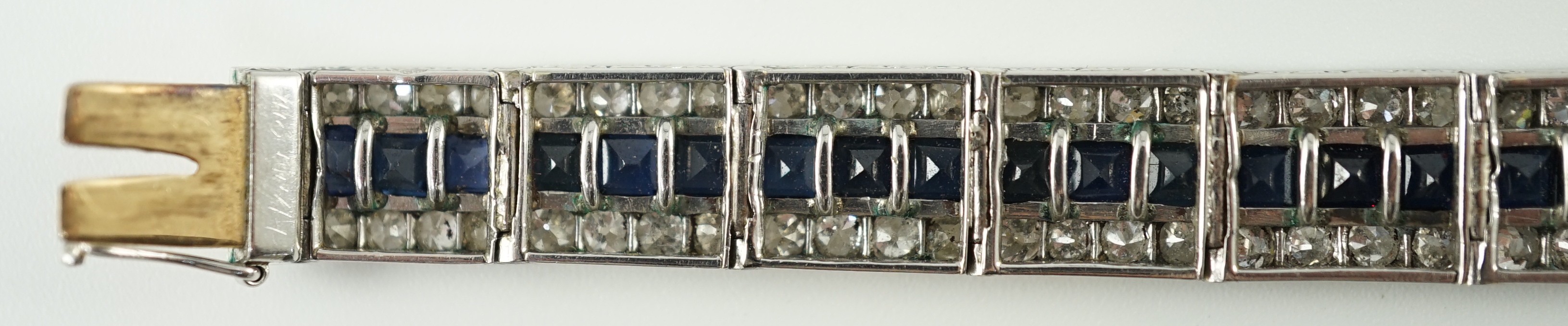 A 1920’s white gold, sapphire and diamond set triple line bracelet